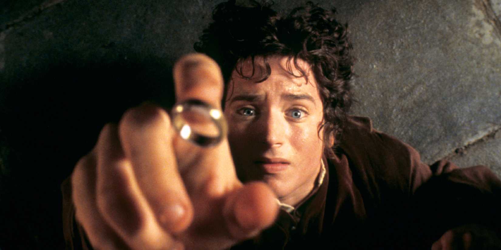 Frodo on the floor about to put on the One Ring in The Lord of the Rings: The Fellowship of the Ring