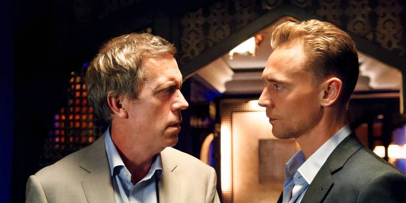 Roper and Pine standing close and looking at each other in The Night Manager Season 1