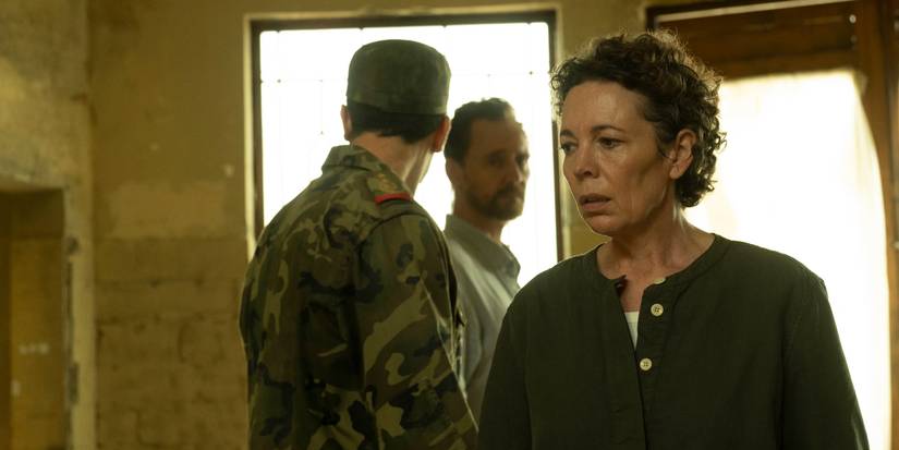 Angela Burr looking upset with Jonathan Pine and a soldier standing behind her in The Night Manager Season 2