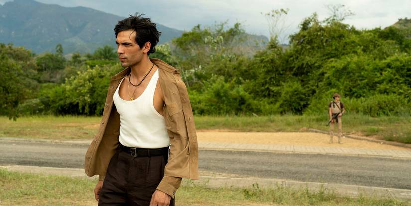 Teddy looking severe and walking outside in The Night Manager Season 2 Episode 5