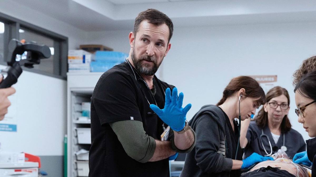 Dr. Robby holding up a hand in the ER