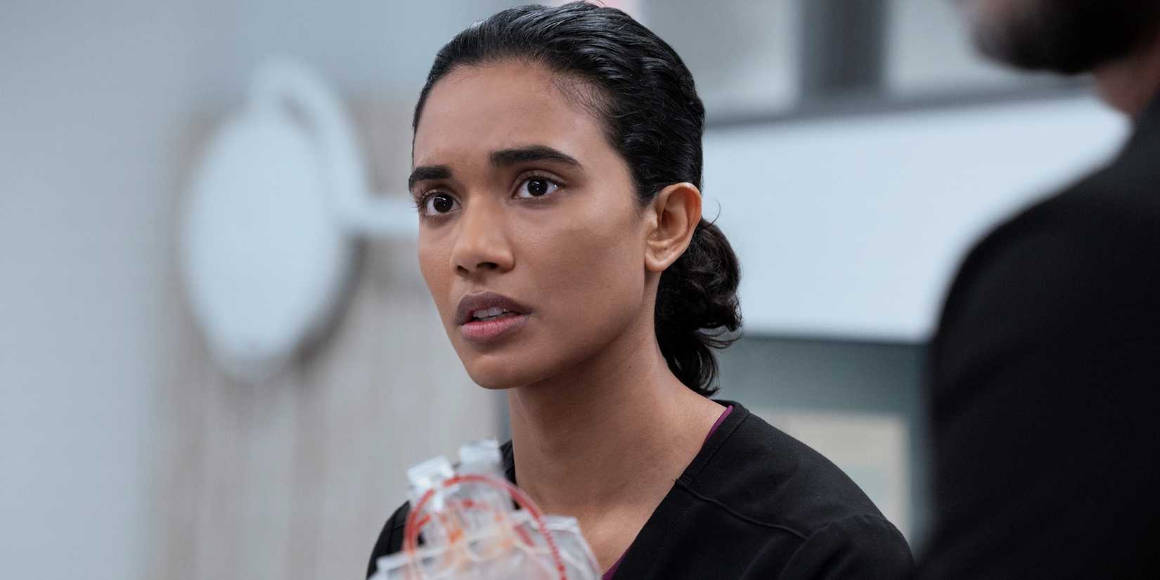 Supriya Ganesh holding equipment and looking serious in The Pitt Season 2