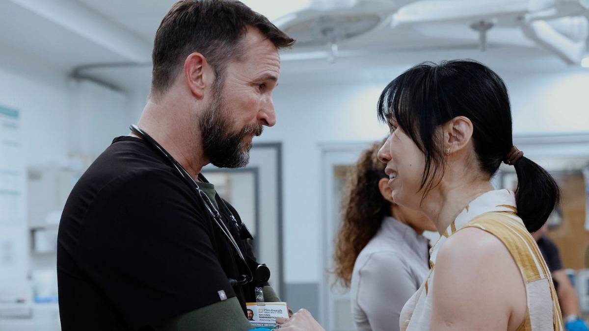 Dr. Robby talking to a crying patient