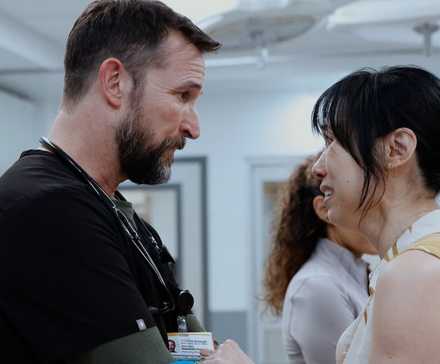 Dr. Robby talking to a crying patient