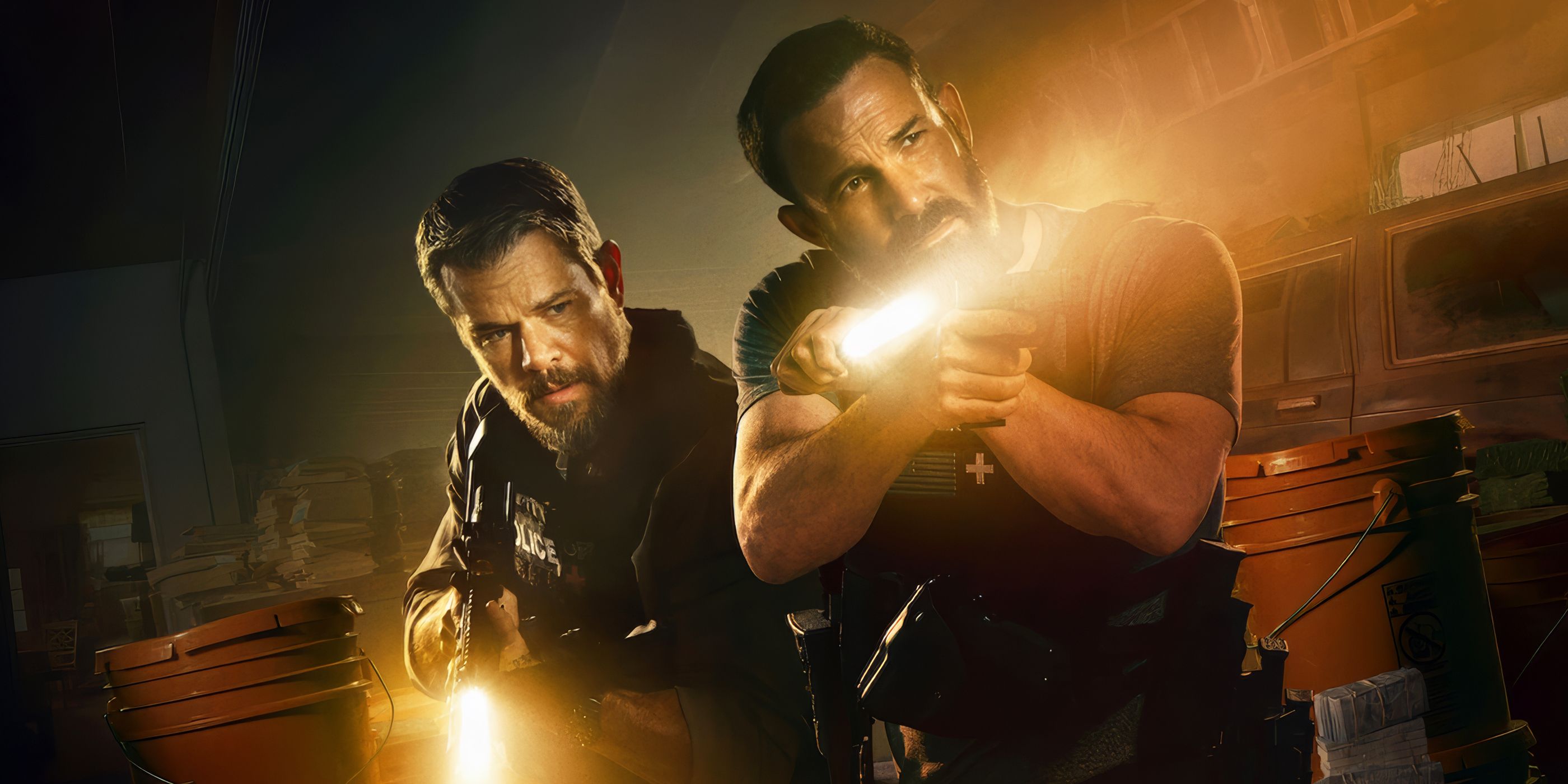 Lieutenant Dane Dumars and Det Sergeant JD Byrne inspecting something in uniform with flashlights in The Rip.