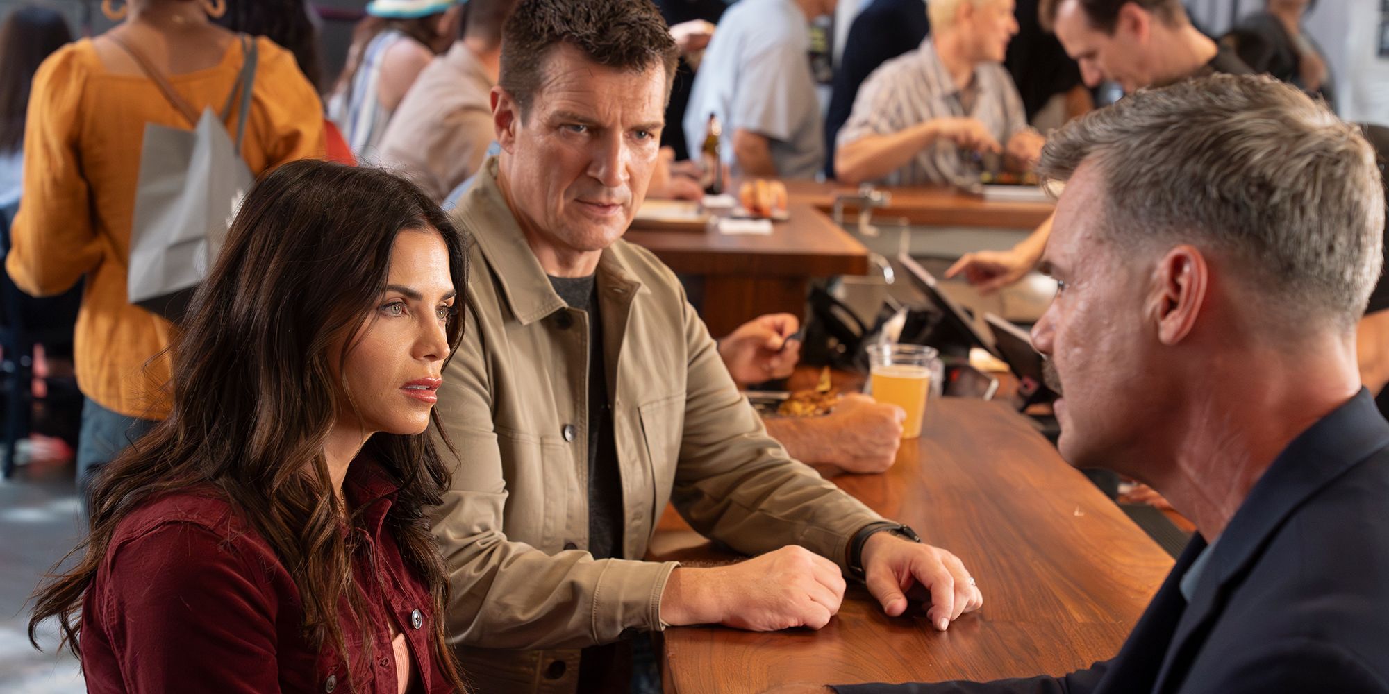 Jenna Dewan and Nathan Fillion talking to Tuc Watkins in The Rookie Season 8, Episode 4