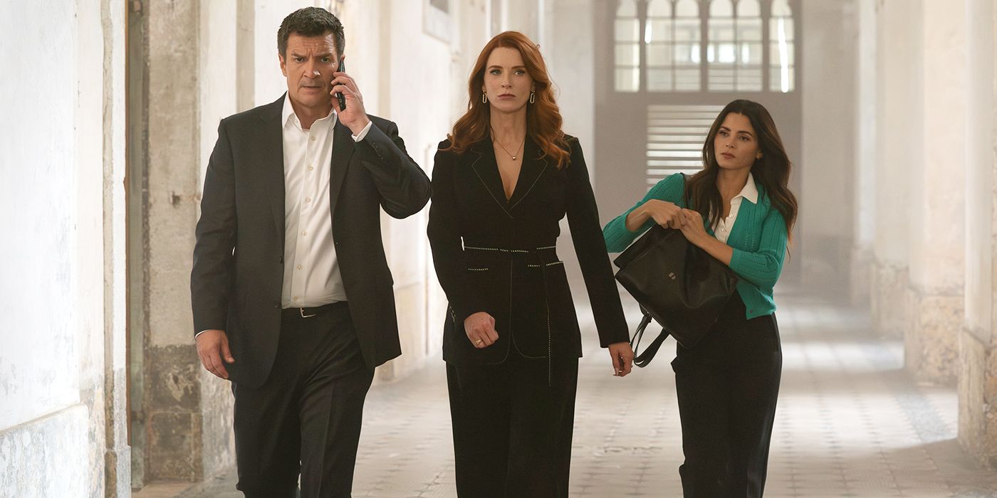 John (Nathan Fillion), Monica (Bridget Regan), and Bailey (Jenna Dewan) walk together in Prague in The Rookie's Season 8 premiere. 