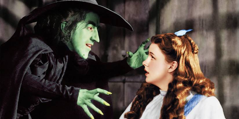 The Wicked Witch of the West (Margaret Hamilton) confronts Dorothy (Judy Garland) while Dorothy looks frightened in The Wizard of Oz