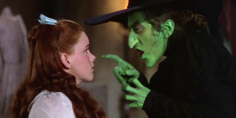 Judy Garland as Dorothy being pointed at by Margaret Hamilton as the Wicked Witch of the West in The Wizard of Oz