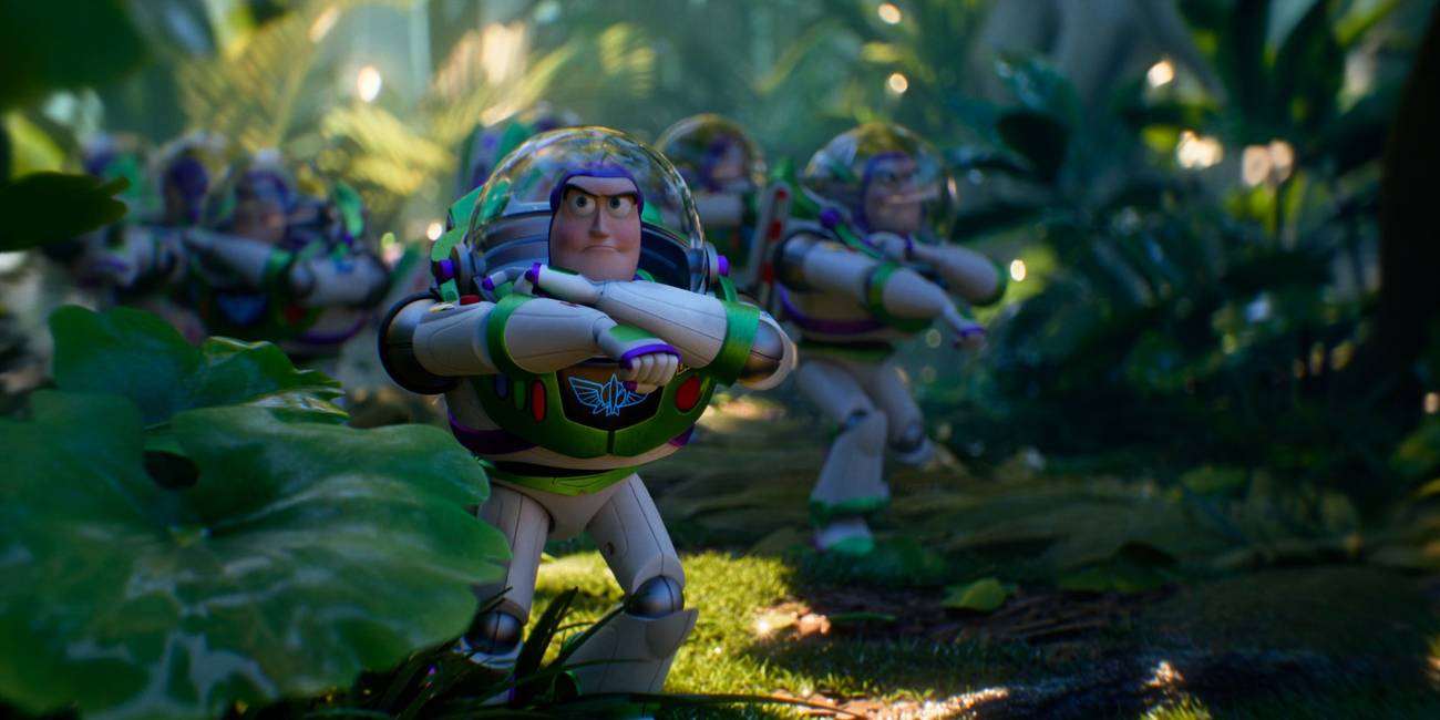 A herd of Buzz Lightyears walk stealthily through plants in Toy Story 5.
