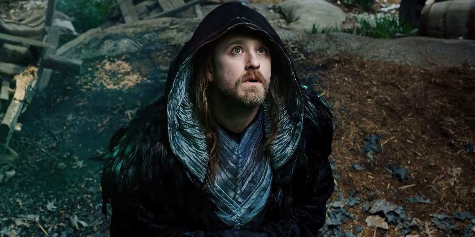 Travis Fimmel under a cloaked hood looking to the sky in 'Warcraft'