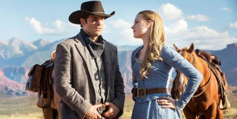 Evan Rachel Wood as Dolores and James Marsden as Teddy standing by their horses in Westworld Season 1 Episode 1