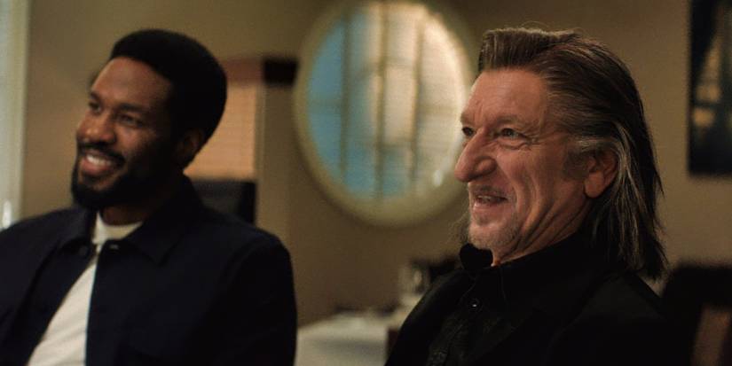 Yahya Abdul-Mateen II and Ben Kingsley laughing and looking in the same direction in Wonder Man Episode 7.