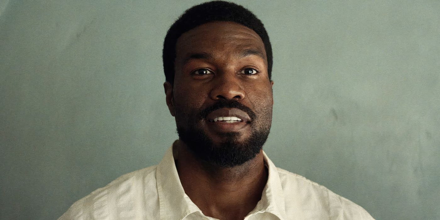 Somin smiling against a grey backdrop