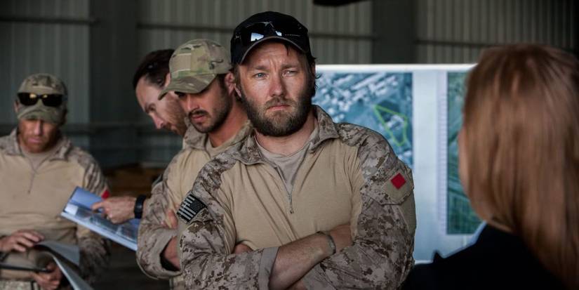 Joel Edgerton listening to someone in a military outpost in Zero Dark Thirty