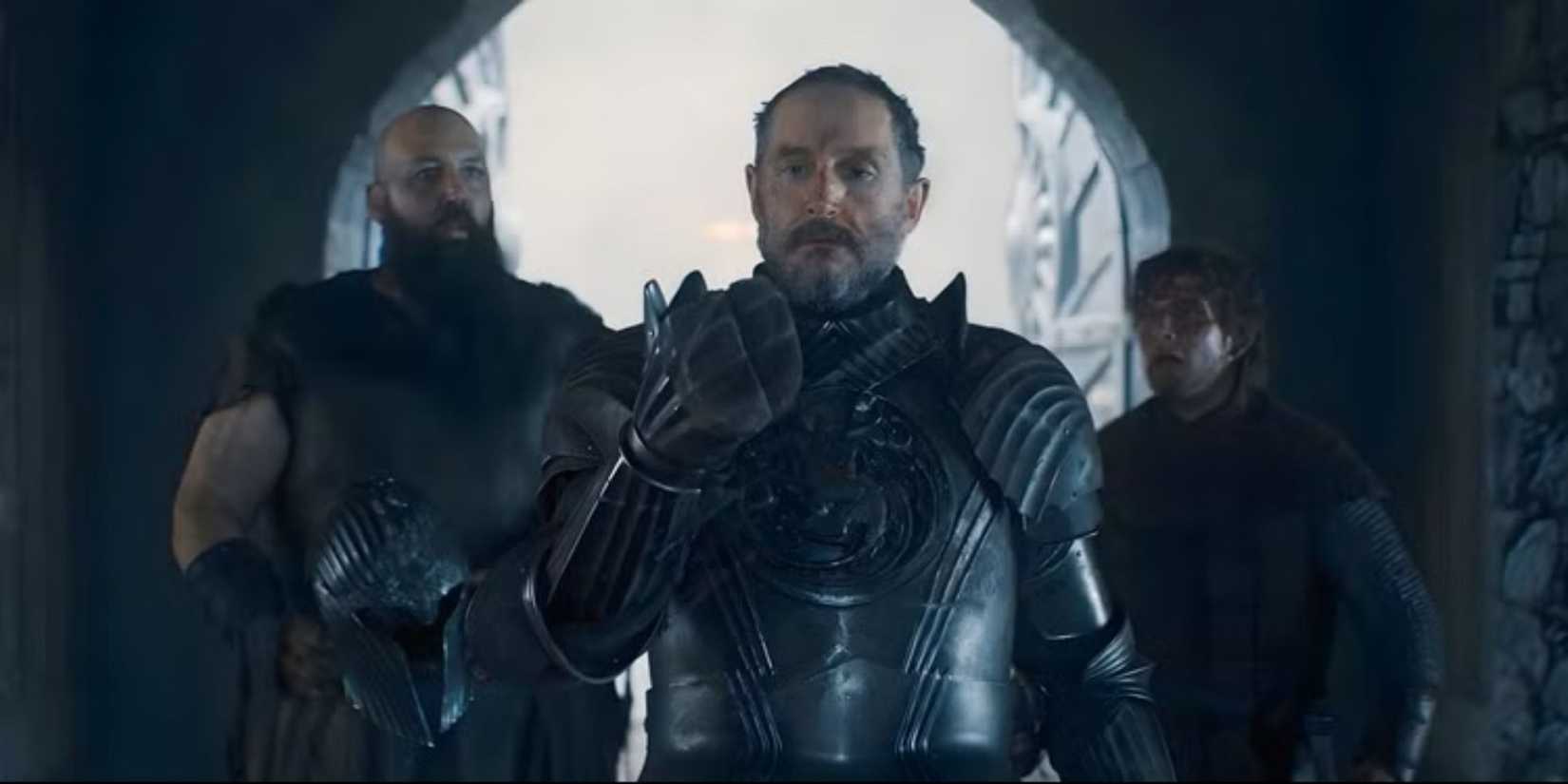 Prince Baelor Targaryen looks at his hand while Steely Pate and Ser Raymun Fossoway look in horror