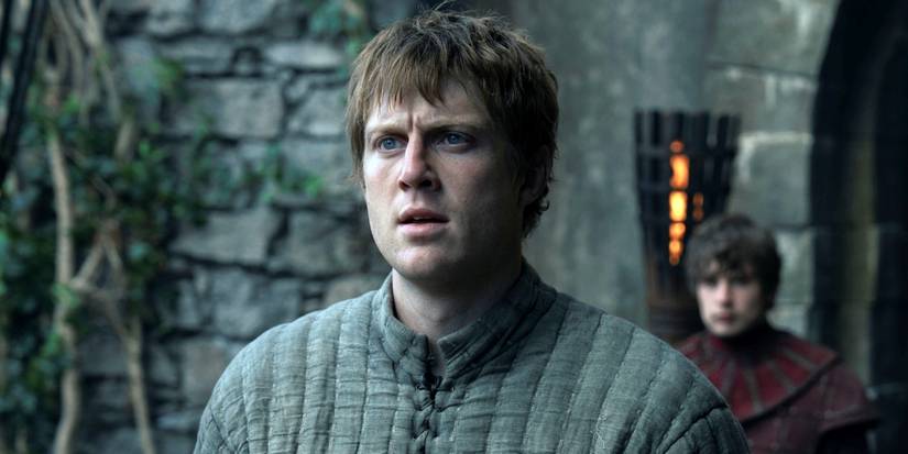 Peter Claffey as Dunk standing outside looking serious in A Knight of the Seven Kingdoms