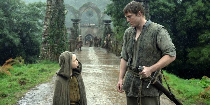 Peter Claffey as Dunk looking down in the rain at Dexter Sol Ansell as Egg in A Knight of the Seven Kingdoms