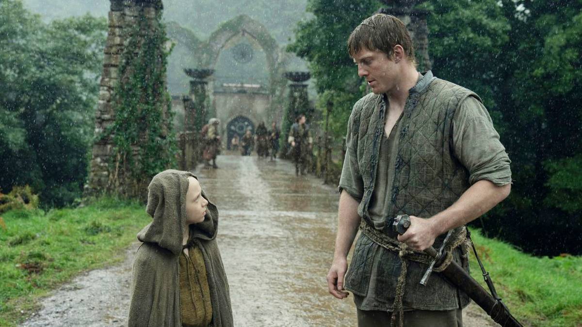 Dunk and Egg looking at each other in the rain