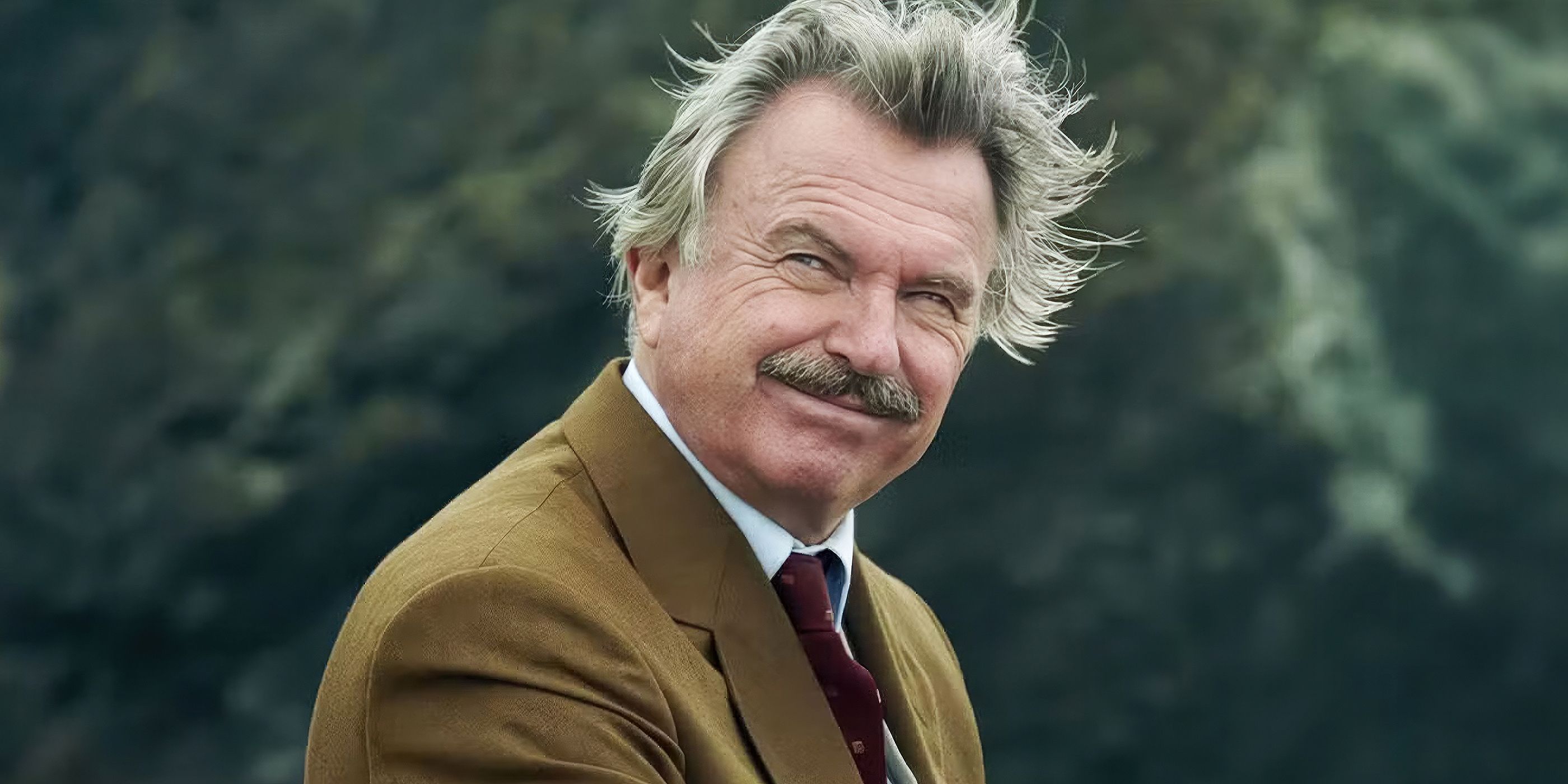 General MacArthur (Sam Neil) smiling in 'And Then There Were None'