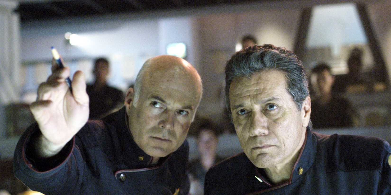 Adam and Tigh leaning together