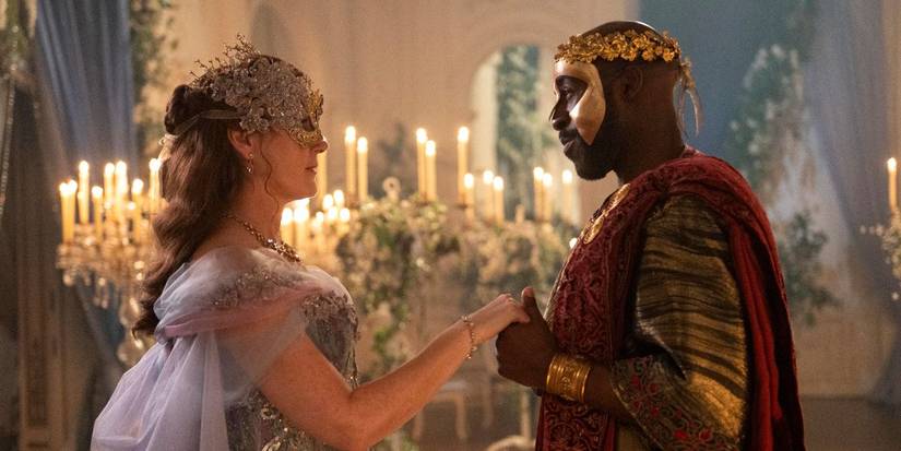 Ruth Gemmell as Violet and Daniel Francis as Anderson wearing masks in Bridgerton Season 4.