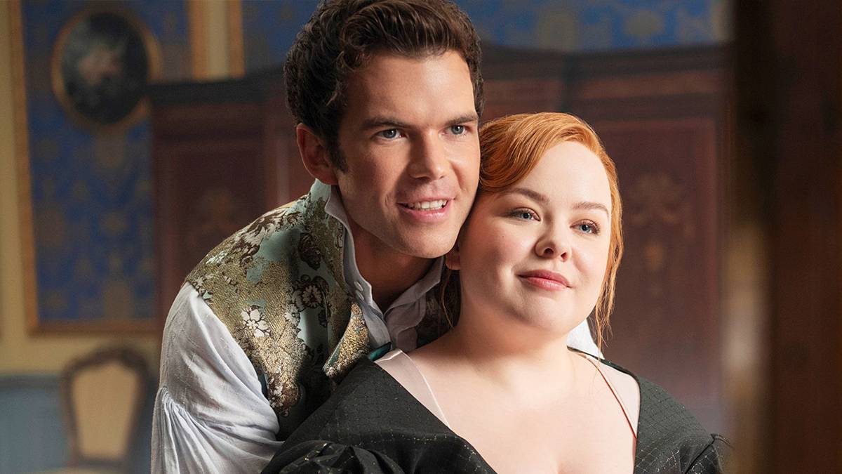 Luke Newton and Nicola Coughlan cuddling and looking in the mirror in Bridgerton Season 4