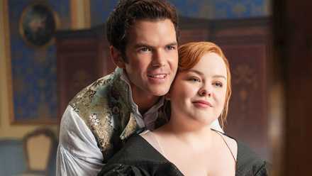 Luke Newton and Nicola Coughlan cuddling and looking in the mirror in Bridgerton Season 4