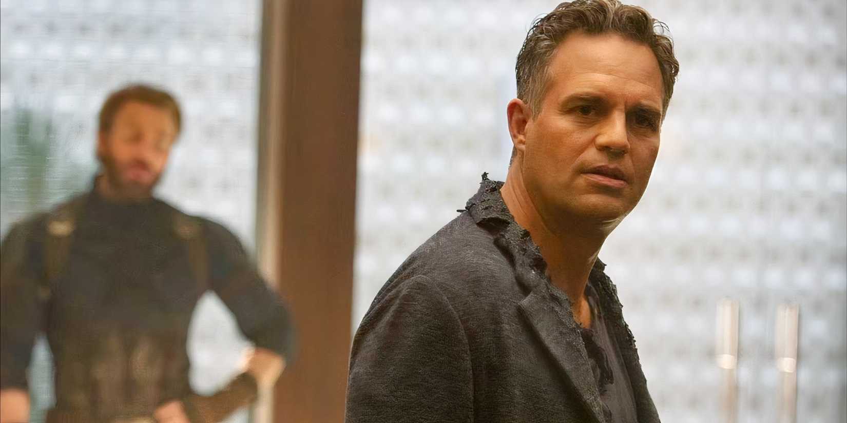 Bruce Banner looking intently with Captain America in the background