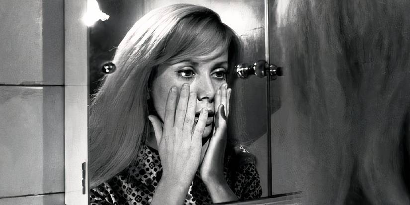 Catherine Deneuve looking at herself in the mirror in Repulsion