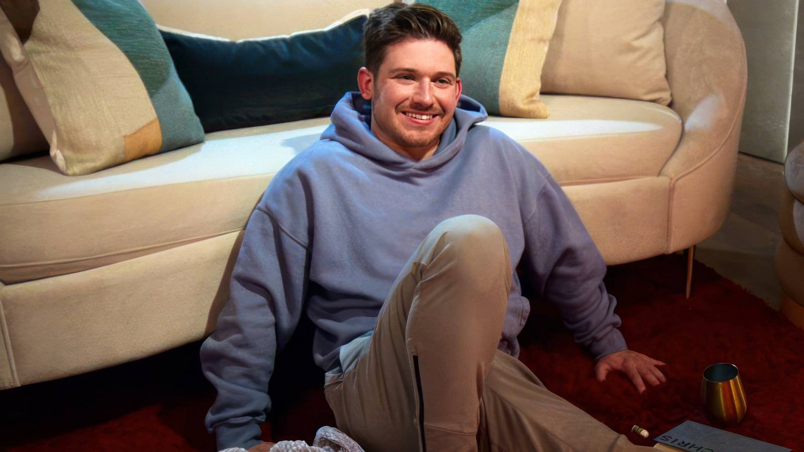 Chris Fusco smiling on the floor in Love Is Blind