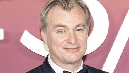 Christopher Nolan wears a tux on the red carpet