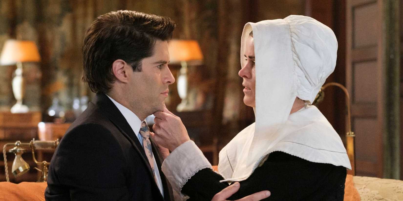 GHOSTS, Thursday, Feb. 26 (8:30-9:00 PM, ET/PT) on the CBS Television Network, and streaming on Paramount+ (live and on-demand for Paramount+ Premium plan subscribers, or on-demand for Paramount+ Essential subscribers the day after the episode airs)*. Pictured L to R: Asher Grodman as Trevor and Mary Holland as Patience. Photo: Bertrand Calmeau/CBS ©2025 CBS Broadcasting, Inc. All Rights Reserved.