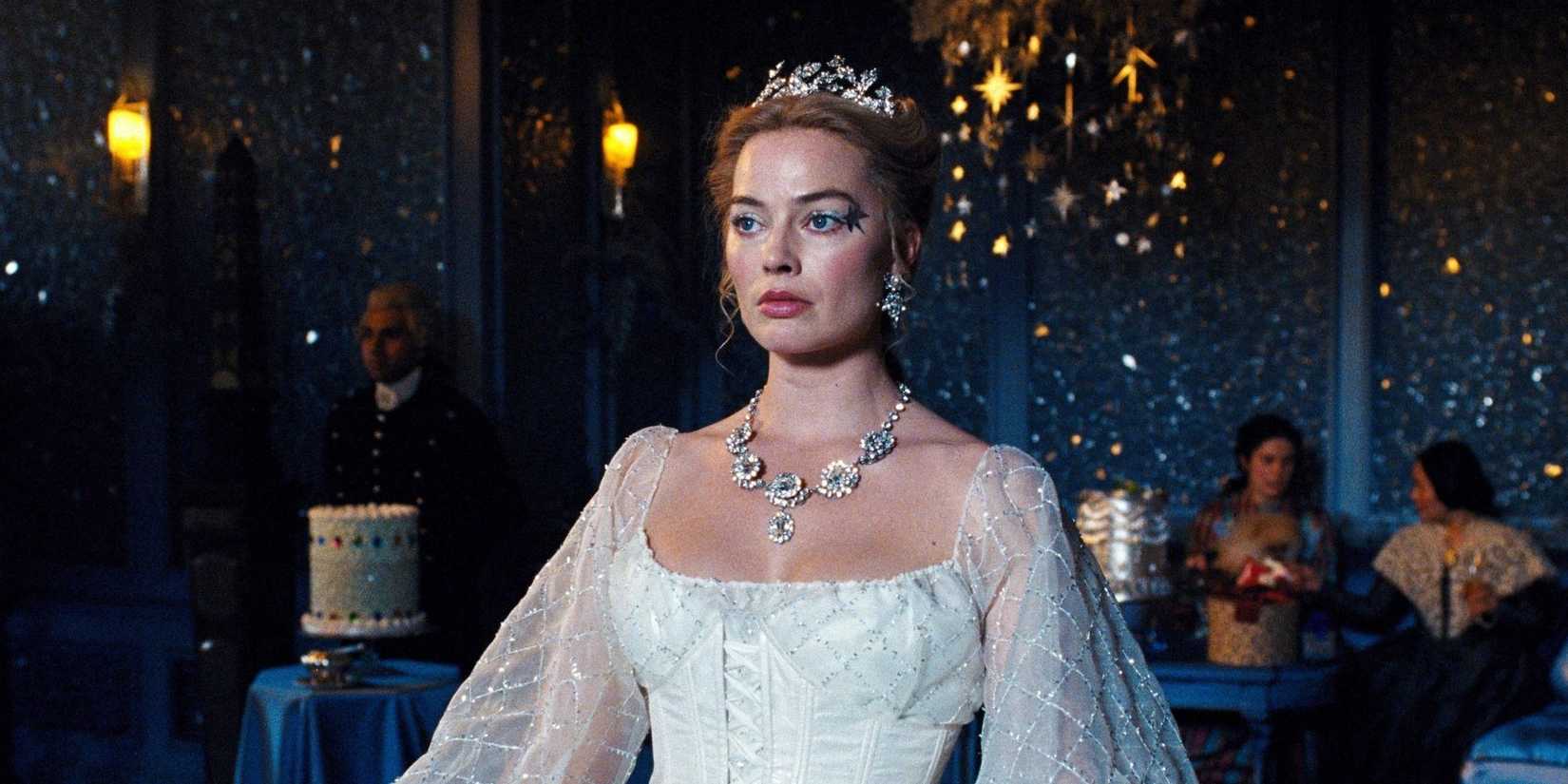 WUTHERING HEIGHTS, Margot Robbie stands at a fancy wedding