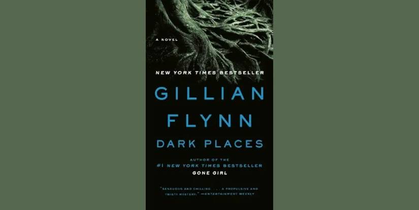 A tree's roots with the title on the book cover of Dark Places by Gillian Flynn.