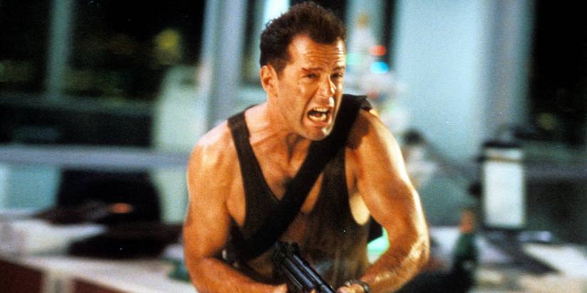 Bruce Willis as John McClane yelling and charging into combat in the first Die Hard (1988)