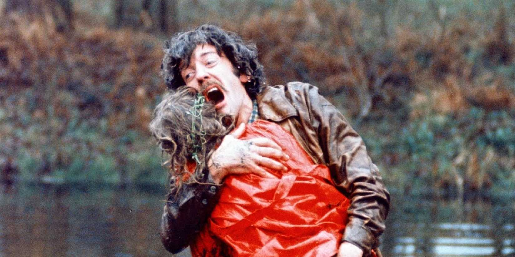 Donald Sutherland hugs a little girl in a red jacket in Don't Look Now.