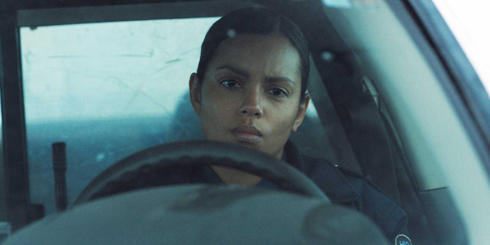 Georgina Campbell sits behind the steering wheel of her patrol car in 'Psycho Killer'
