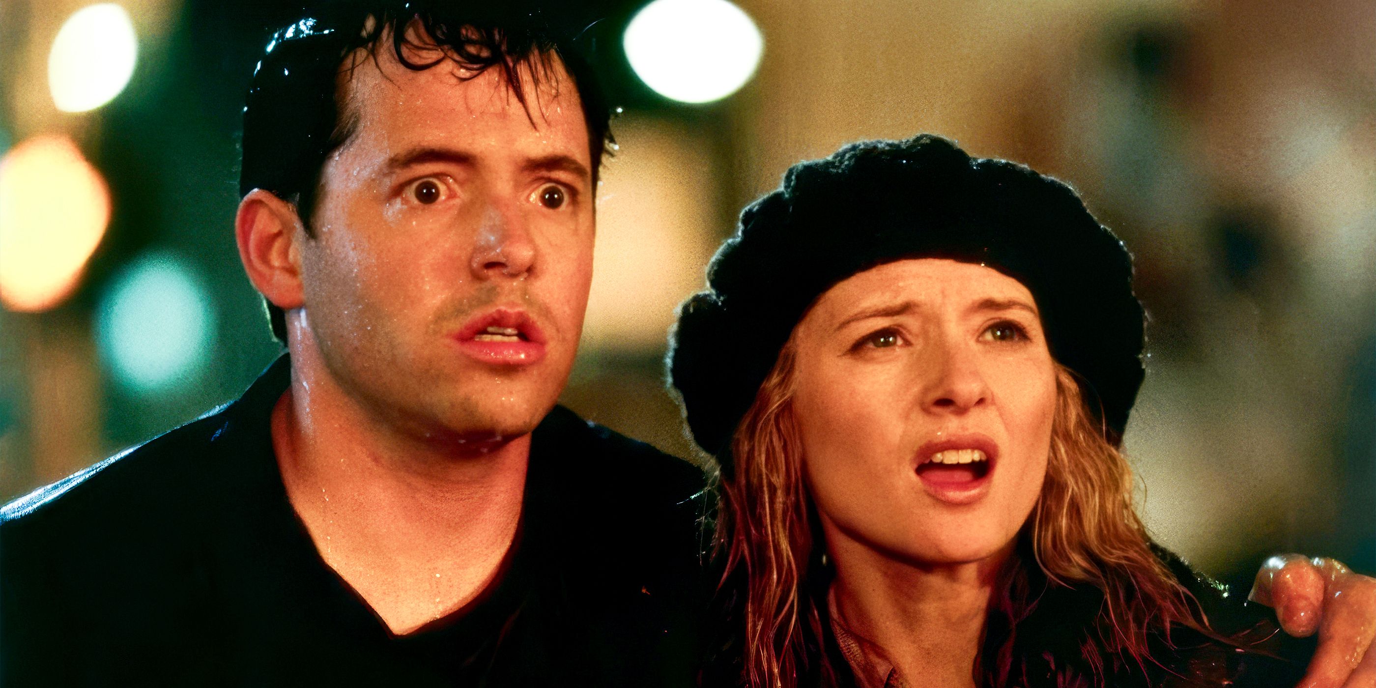Matthew Broderick and Maria Pitillo stand in the street and look on in shock in Godzilla 1998