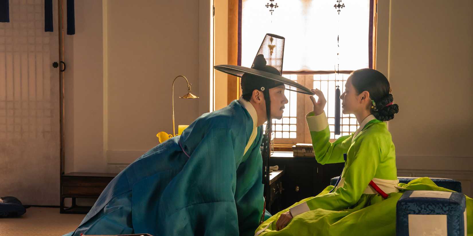 Ji Chang-wook leaning toward Son Ye-jin who is touching his hat in The Scandal