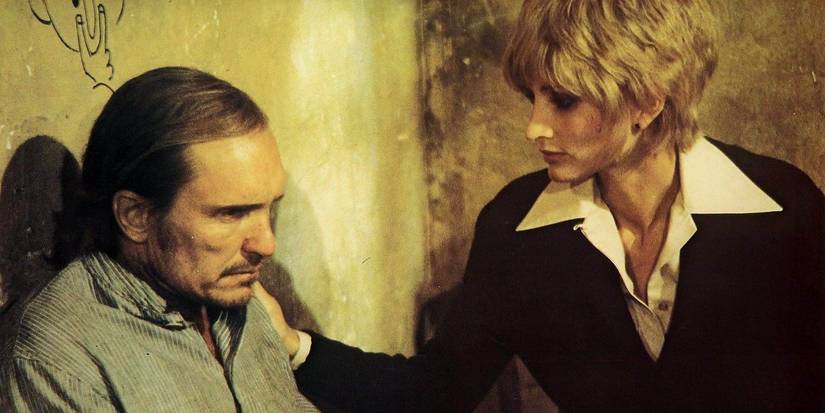 Jill Ireland comforting a saddened Robert Duvall in 'Breakout' (1975)