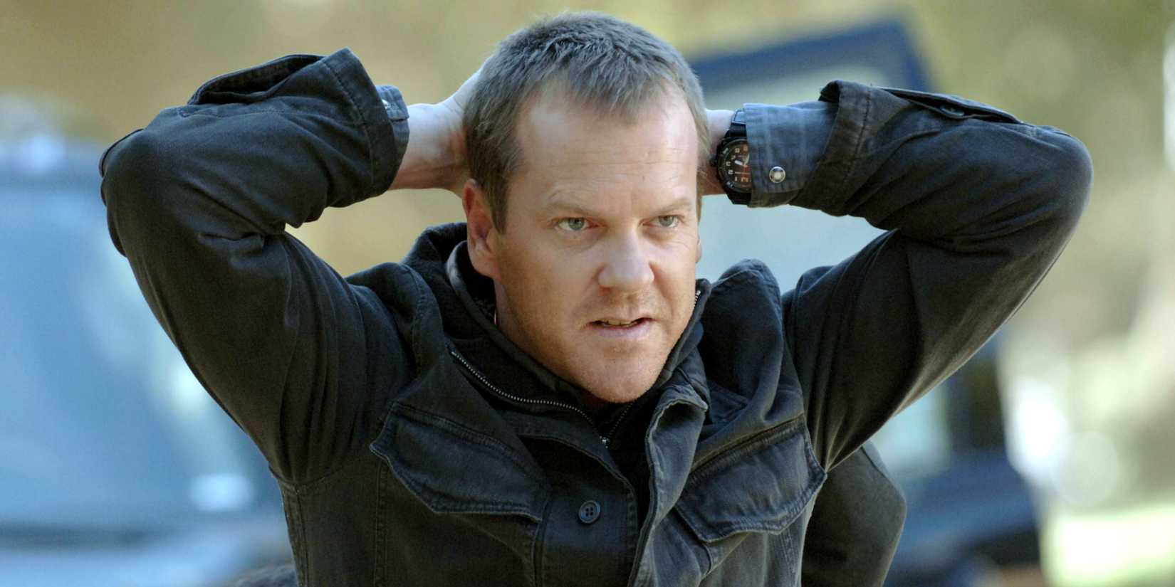 Kiefer Sutherland's Jack Bauer kneeling with his hands behind his head in 24