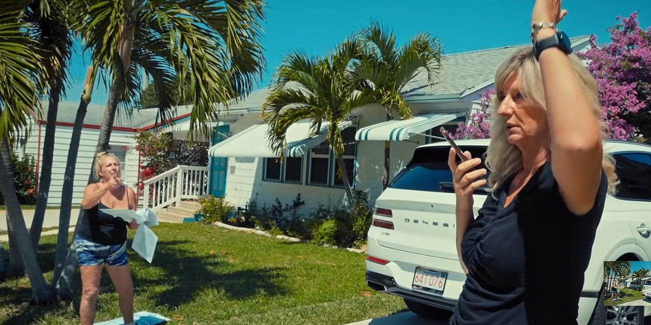 A woman yelling at another woman on the phone in a front yard in 'Neighbors'
