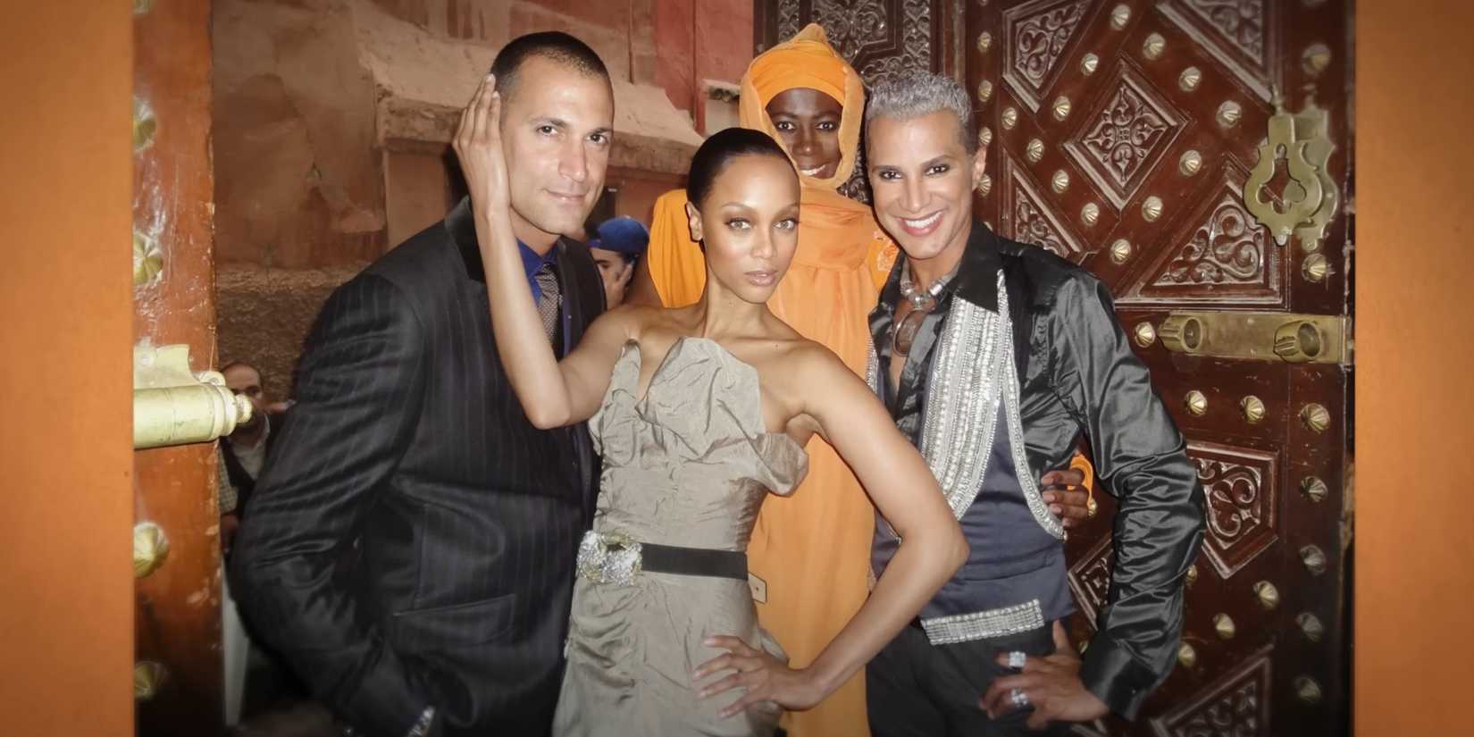 An archival group photo of Nigel Barker, Tyra Banks, Miss J., and Jay Manuel featured in 'Reality Check: Insired America's Next Top Model'