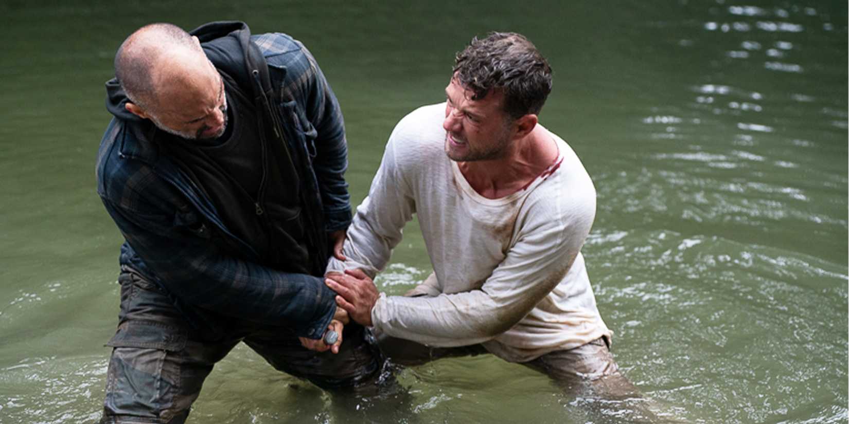 Danny fights off an attack in a river.