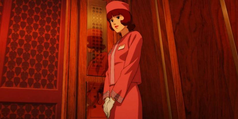 A woman dressed in pink riding an elevator in Paprika