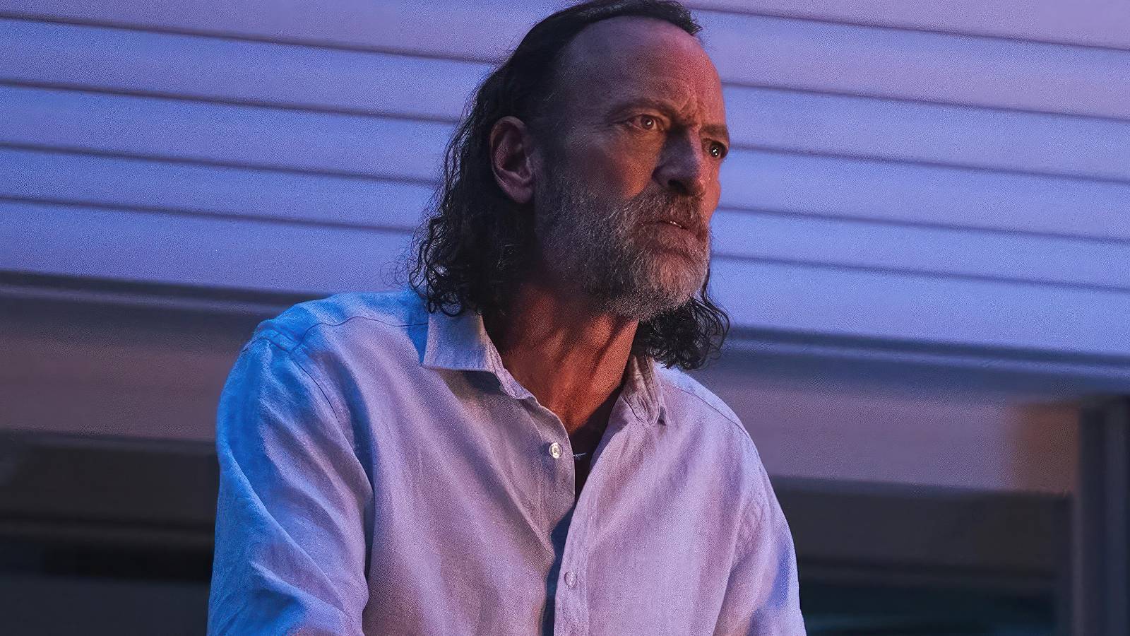 Troy Kotsur sat with a frustrated look on his face in 'Primate'