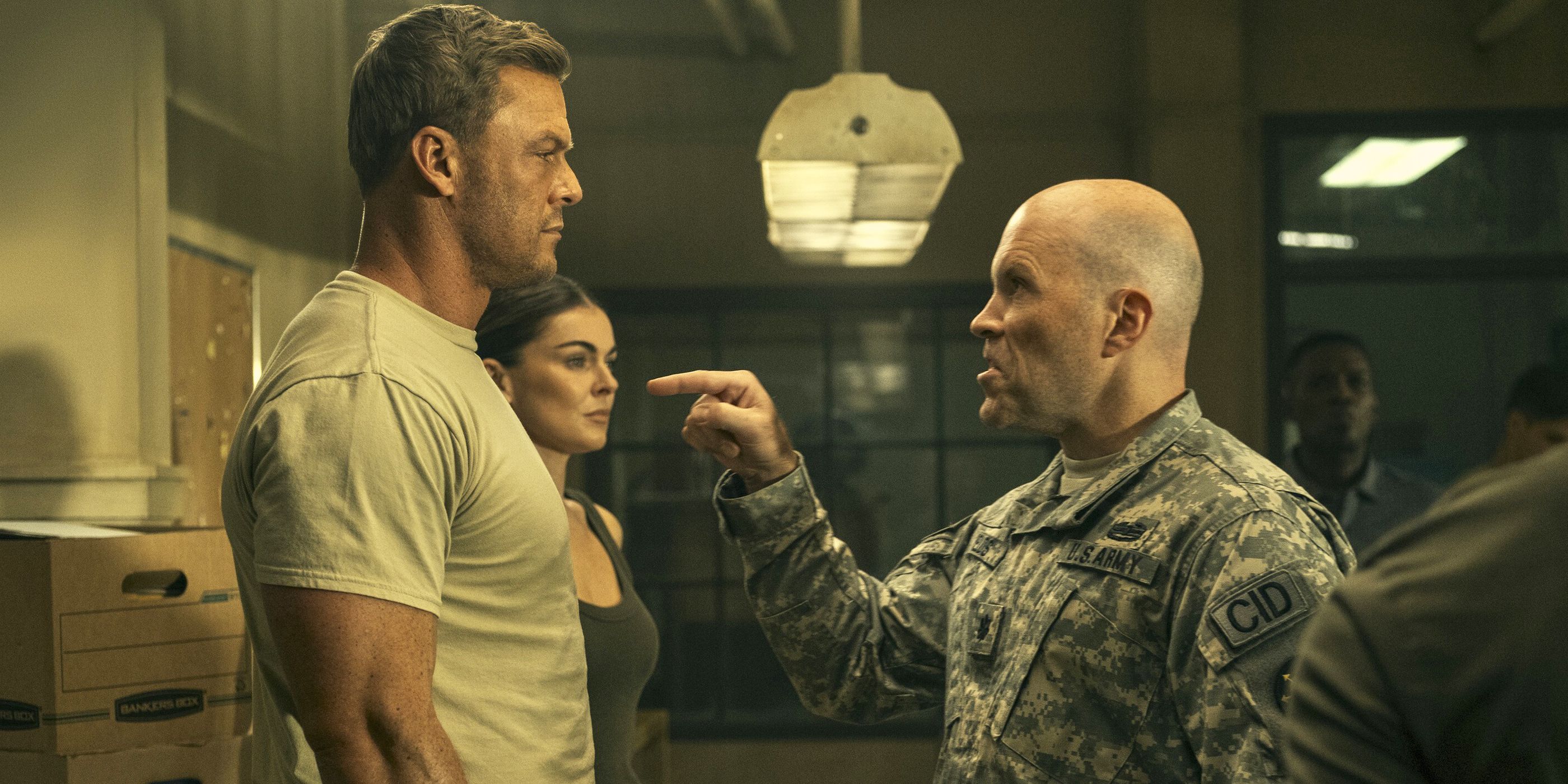 Man in uniform pointing angrily at Reacher