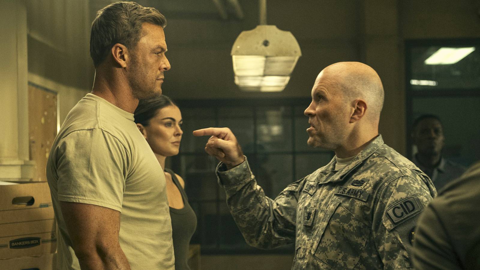 Man in uniform pointing angrily at Reacher