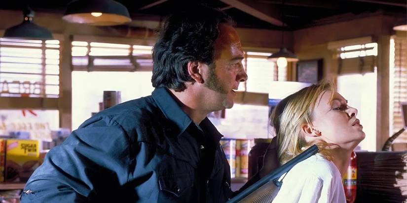 A man aiming a rifle at a woman in Retroactive (1997)